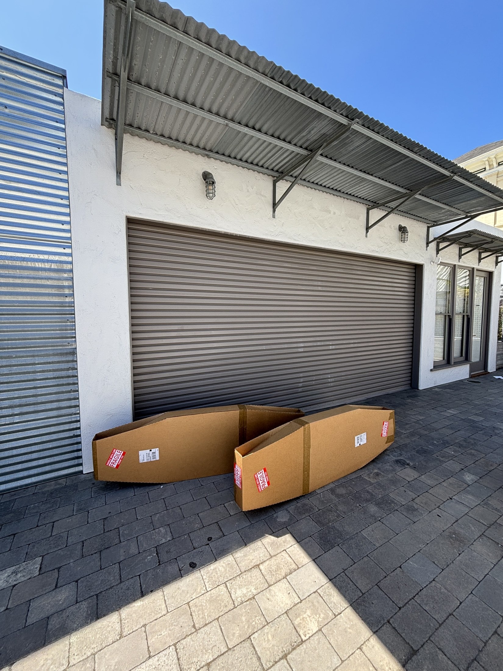 Two boxed surfboards waiting outside the Santa Barbara shop